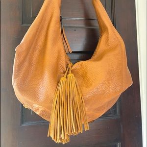 Camel brown leather banana bag.